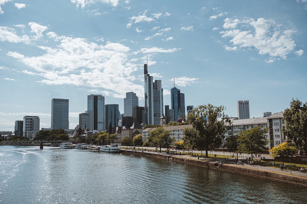 a body of water with a city in the background