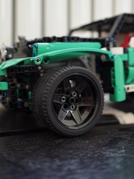 Close-up of intricate wheel and chassis details on a scale model vehicle.
