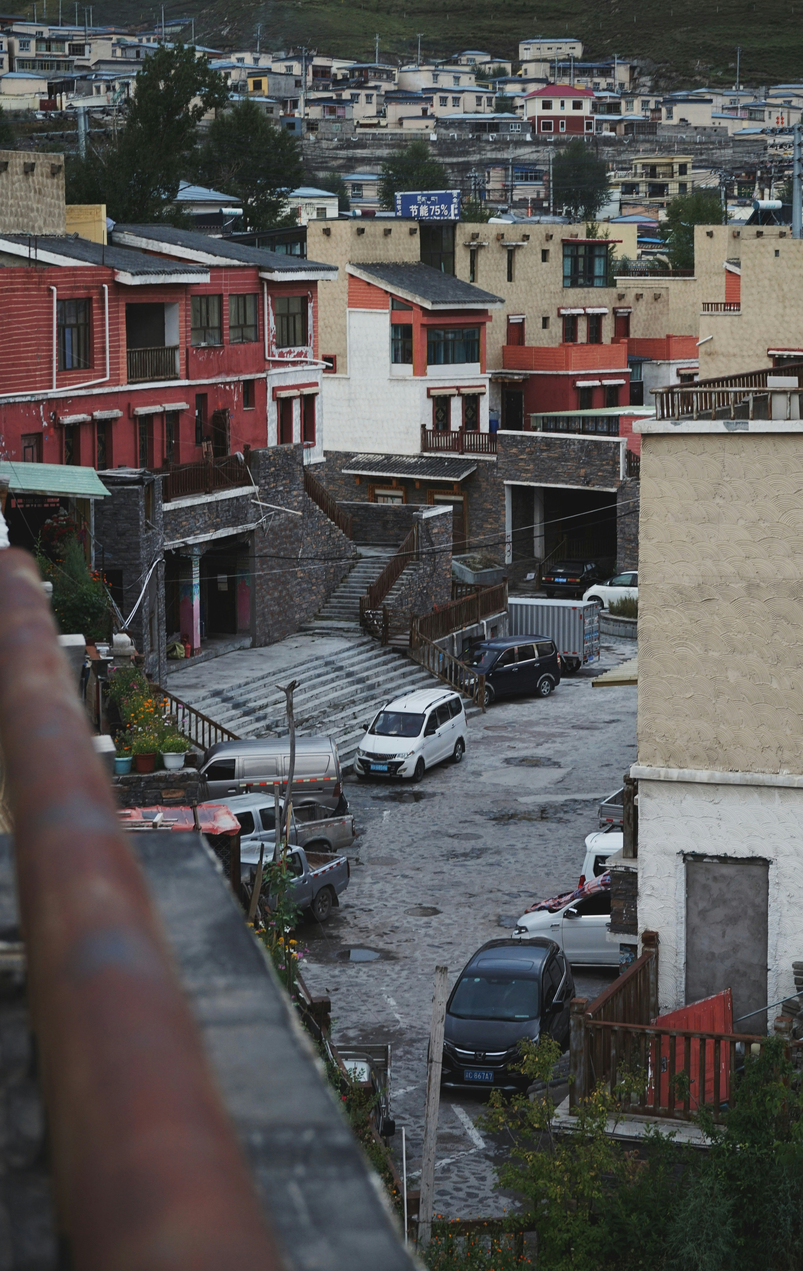a street with cars and buildings