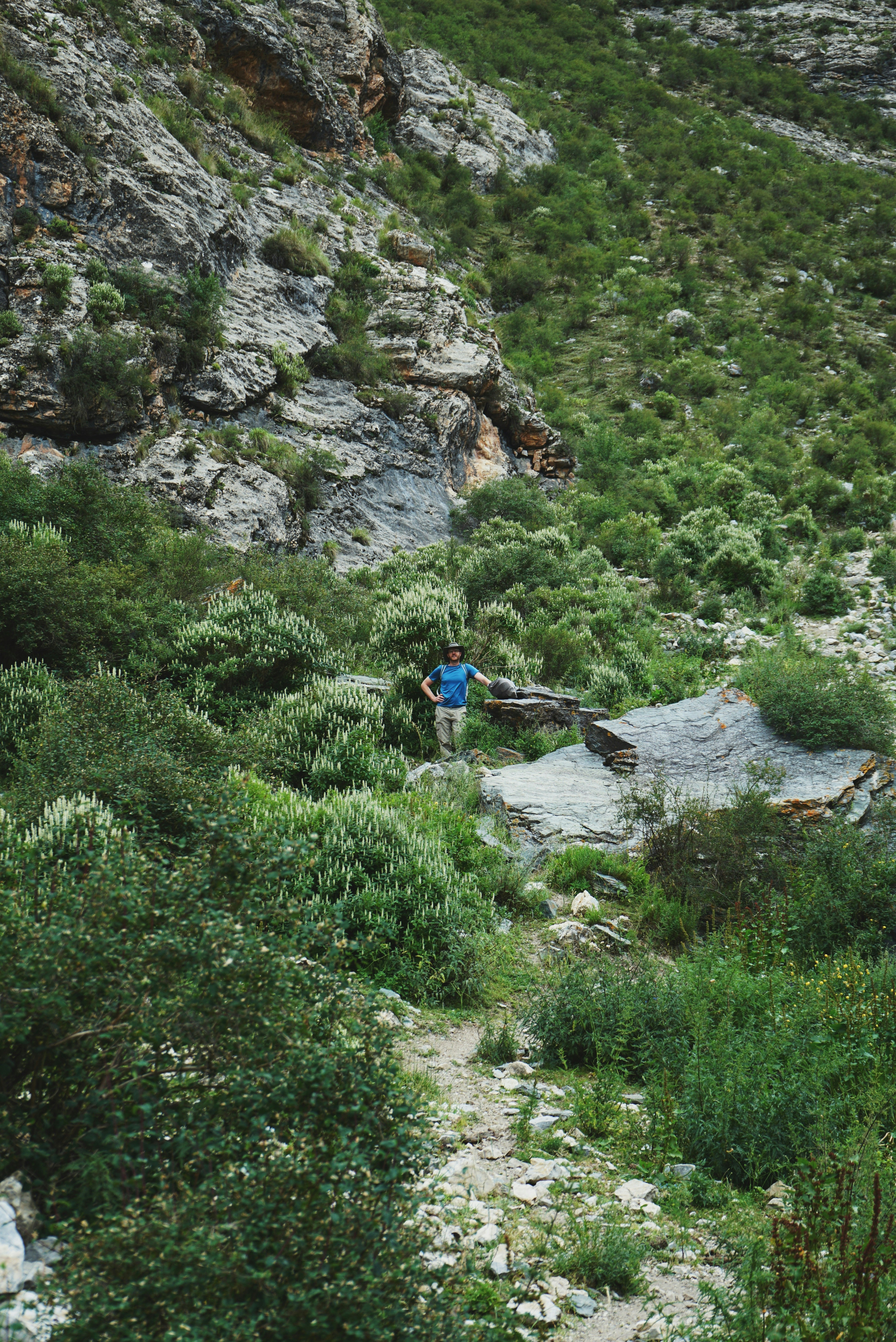 a person standing on a rock ledge