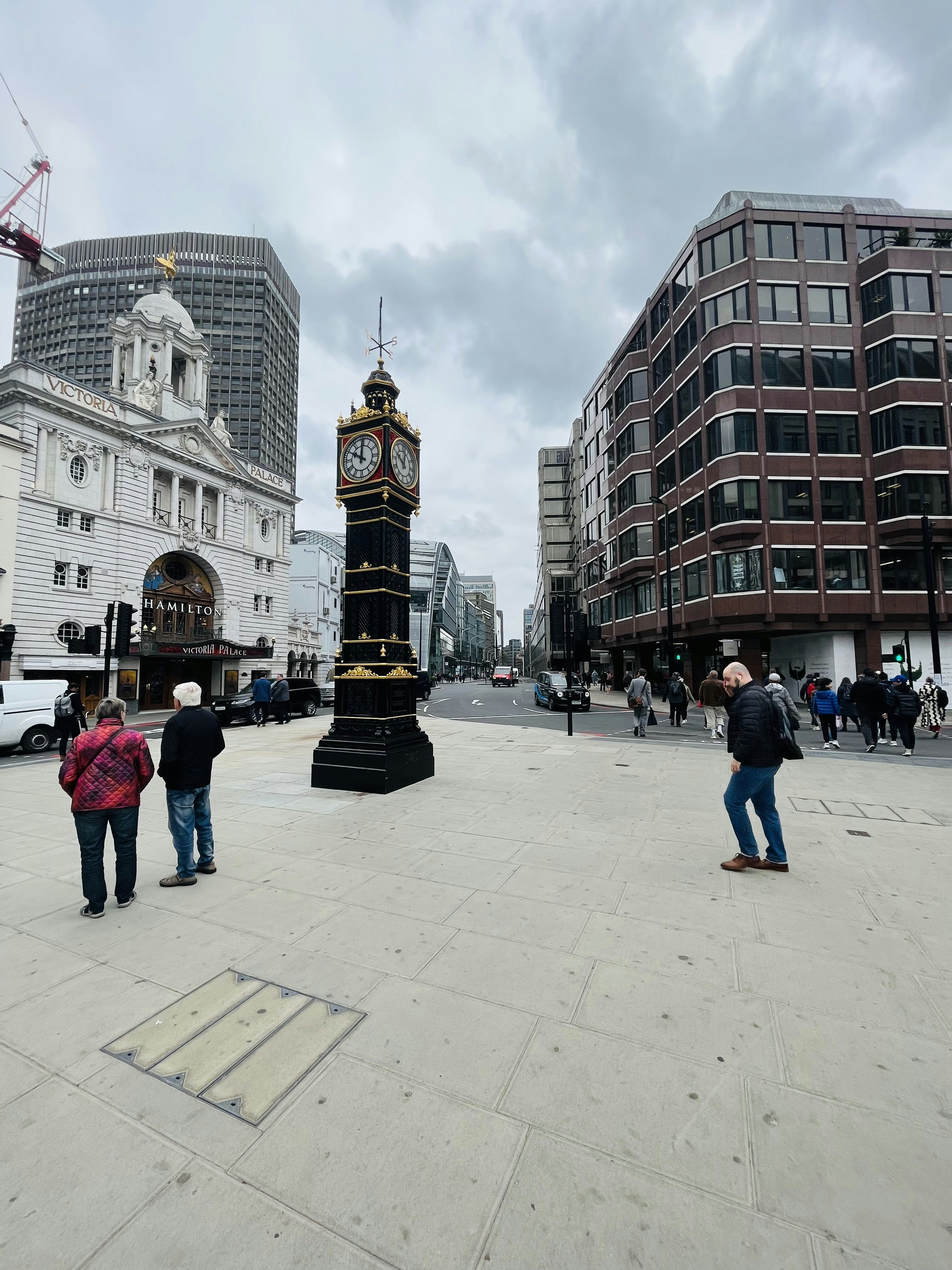 A clock tower in a city photo – Free Car Image on Unsplash