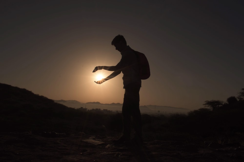 a man holding a light saber