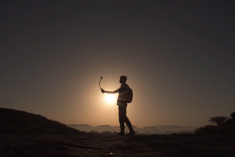 a man holding a golf club