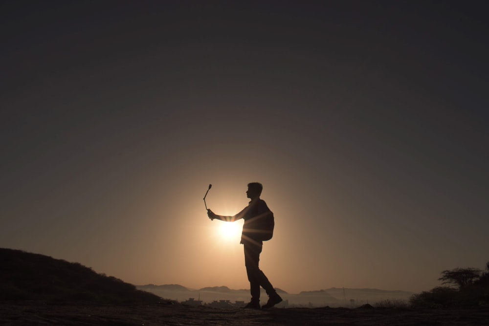 a man holding a golf club