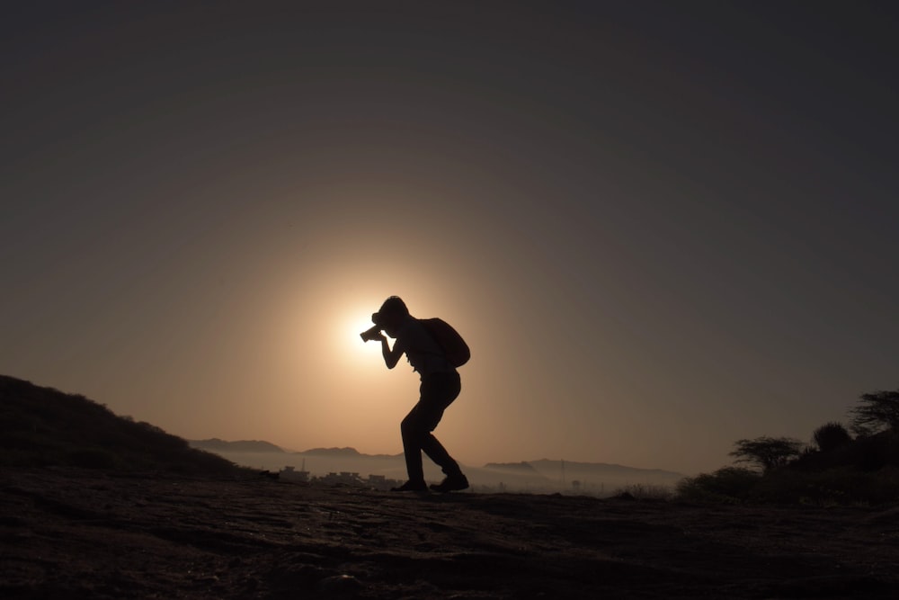 a person walking on a dirt path