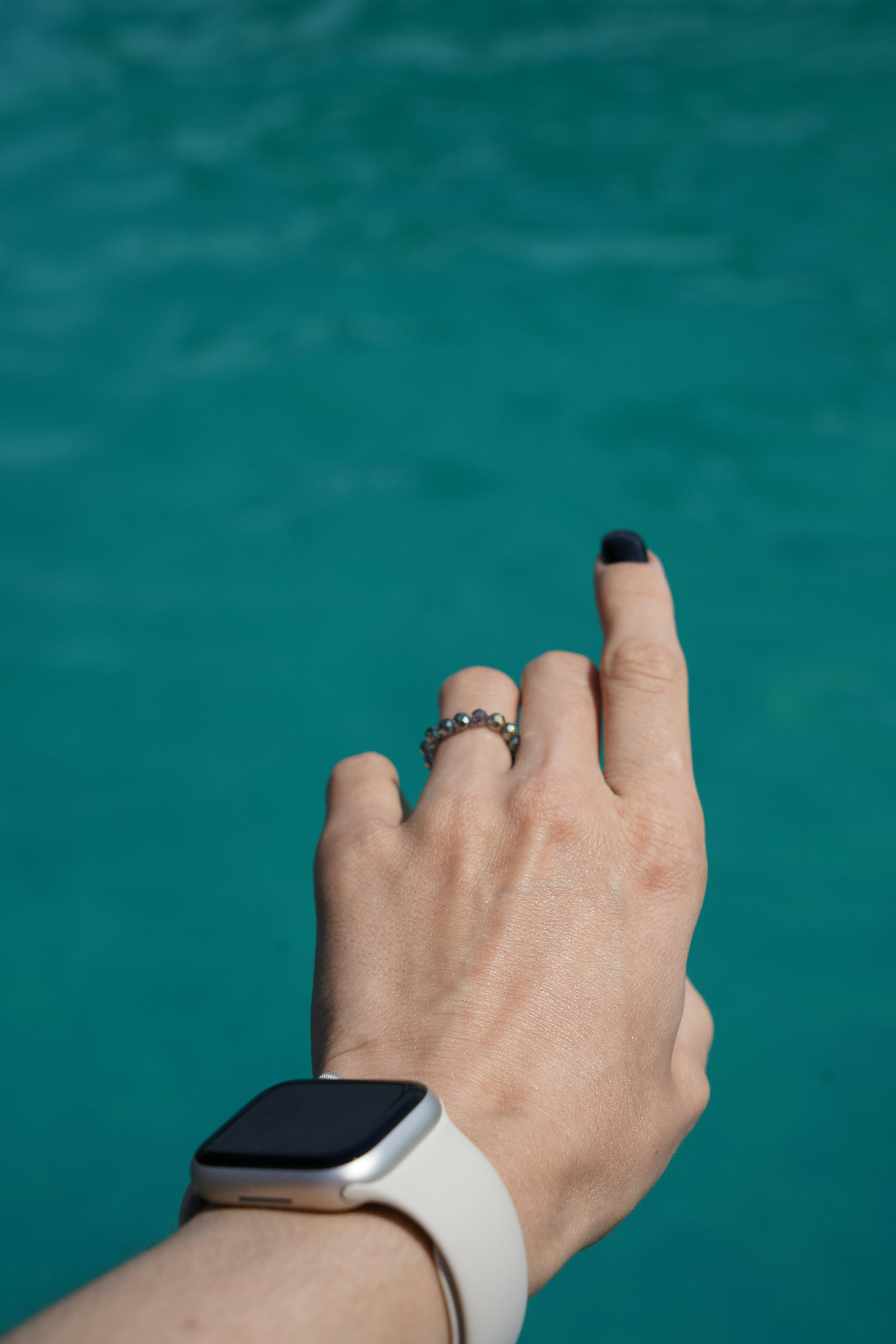 a person's hand with a watch on
