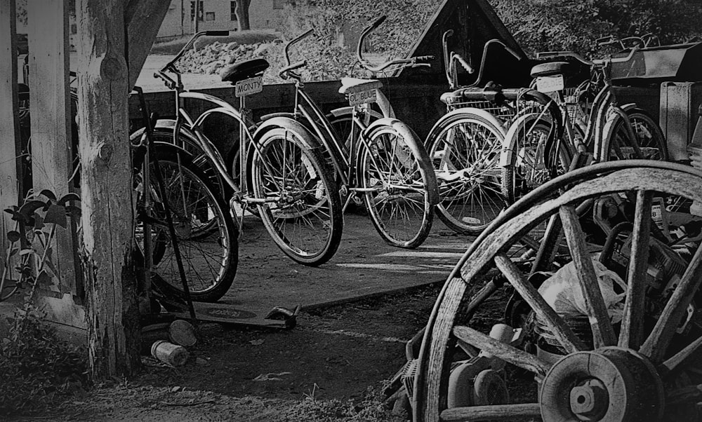 a group of bicycles parked next to a building