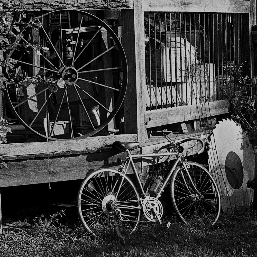 a bicycle parked in front of a gate