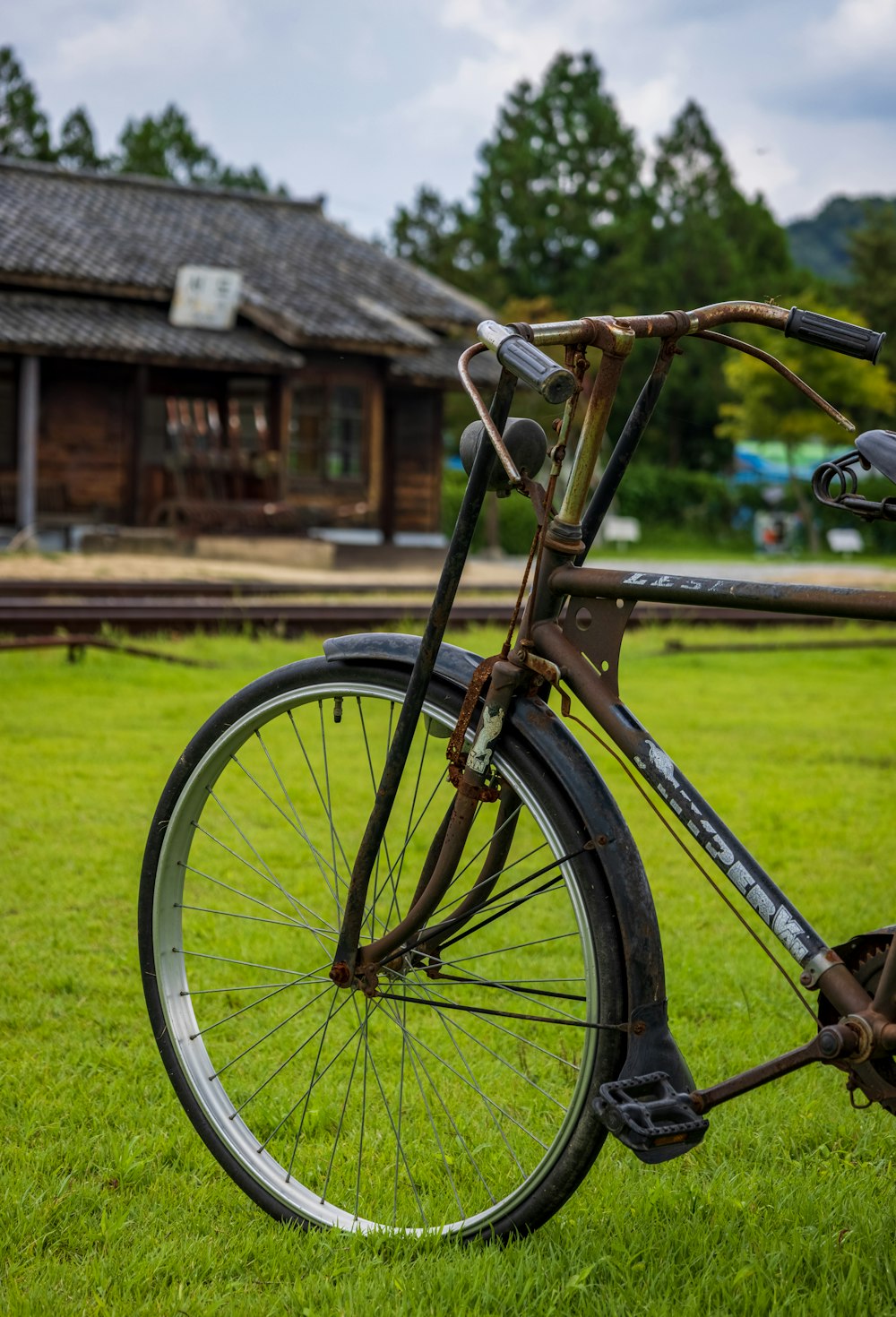 a bicycle parked on grass