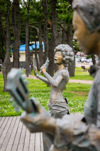 a statue of a person holding a baby