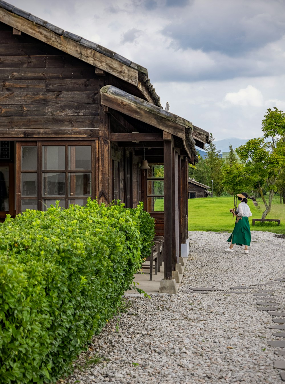 a person walking outside of a house