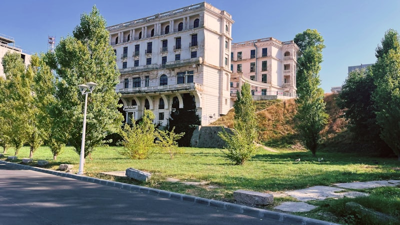 a large building with trees in front of it