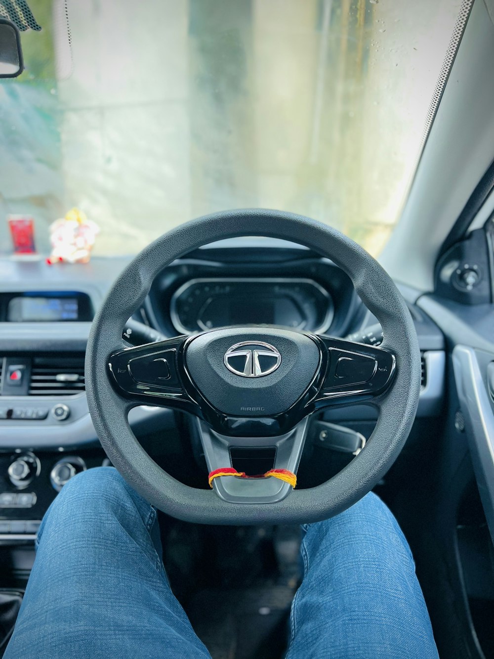 a steering wheel and dashboard of a car