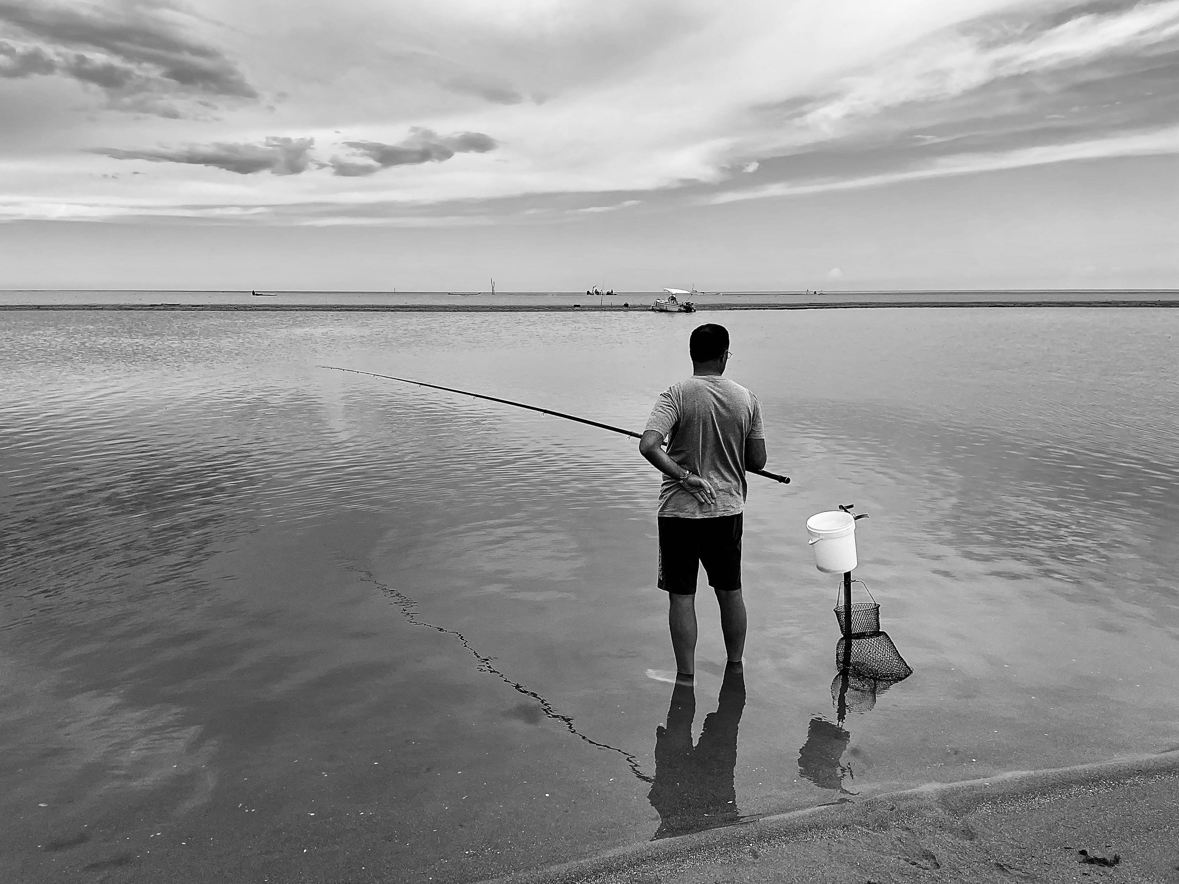 a man fishing on a beach