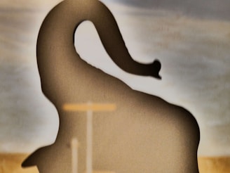 A soft cotton t-shirt with a minimalist elephant silhouette printed on the front.