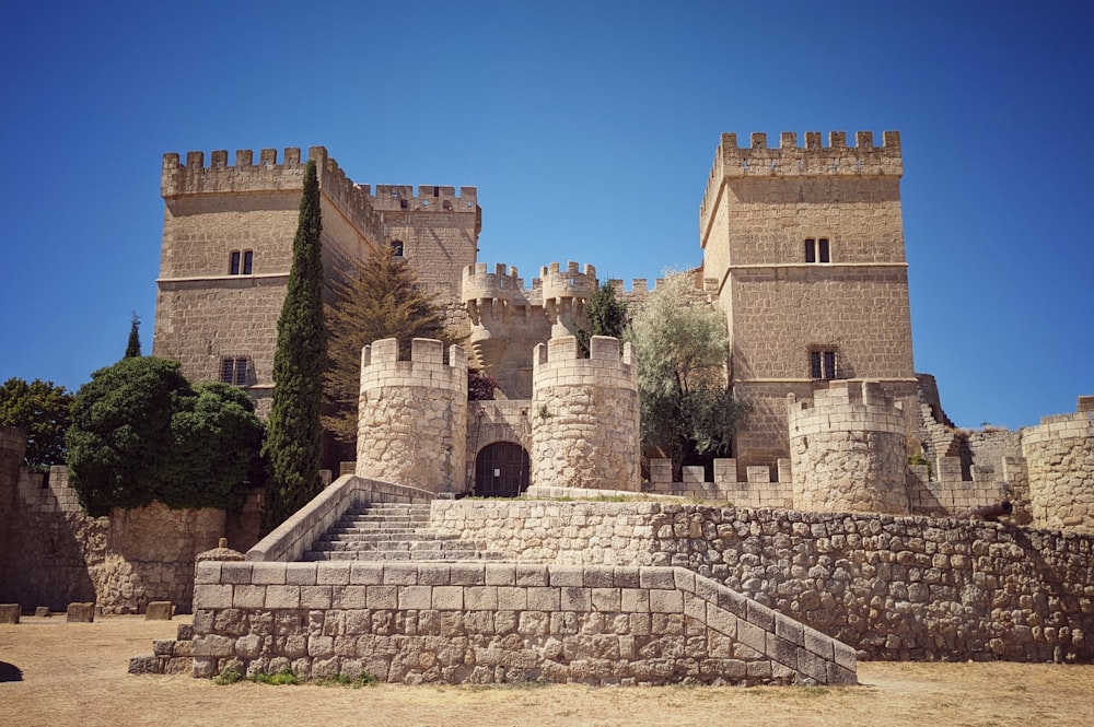 a stone building with a stone wall