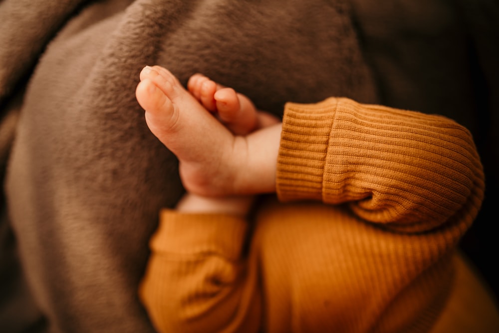 a person holding a brown object