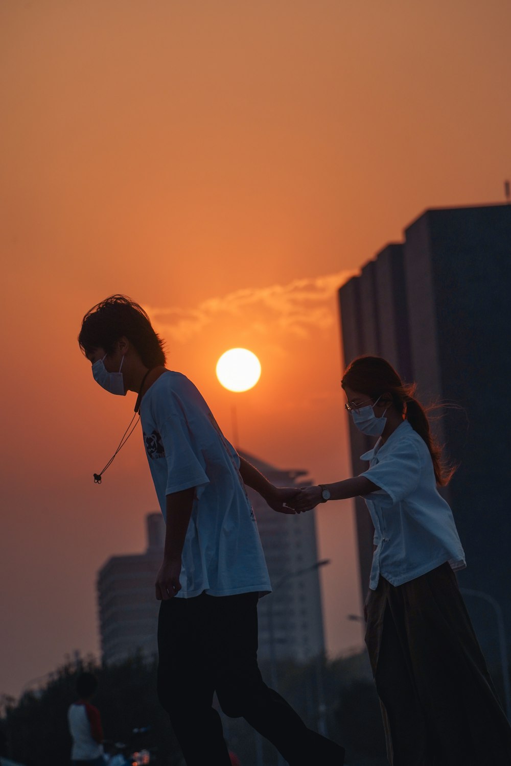 a man and woman holding hands