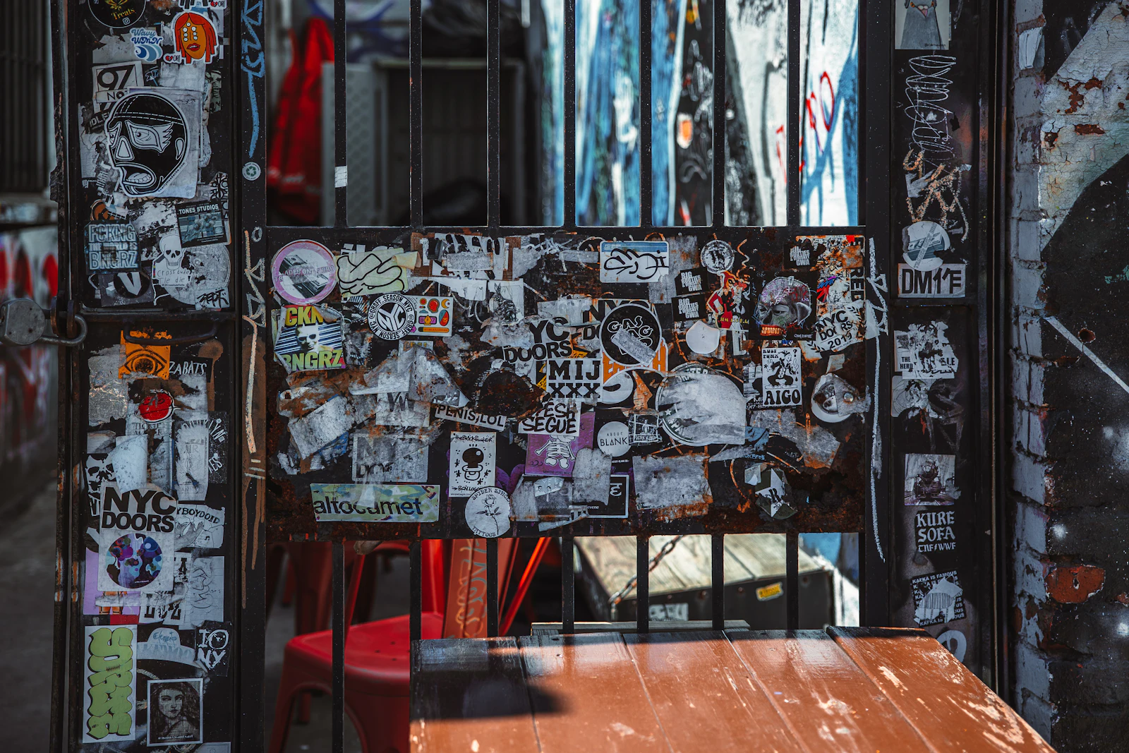 A wall layered with posters and hundreds of stickers from bands, brands and small businesses.