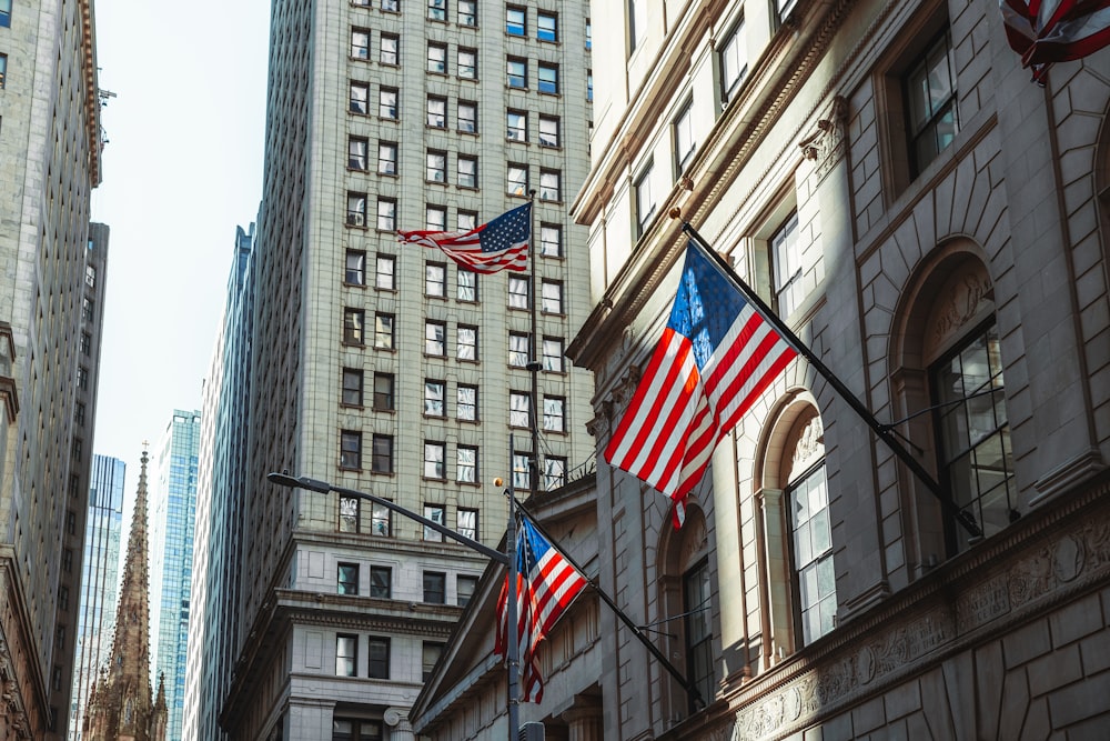 a few flags flying in front of a building