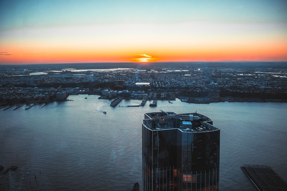 a building with a tower in the middle of a body of water