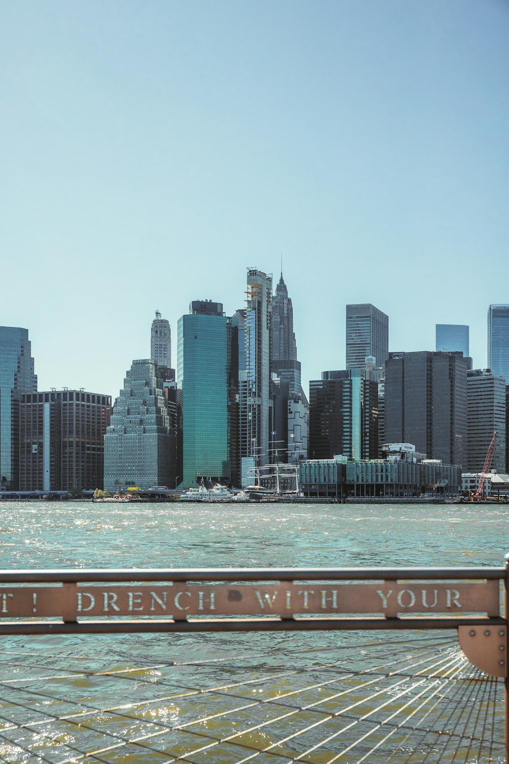 a city skyline with a river