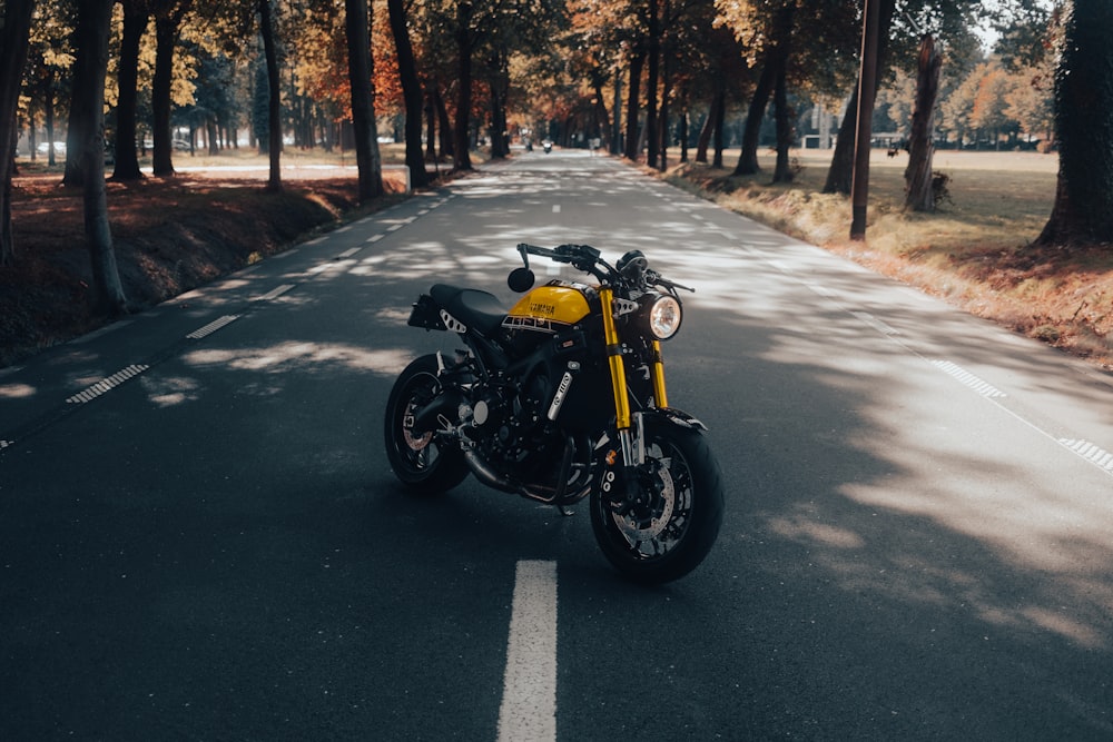 a motorcycle parked on the side of a road