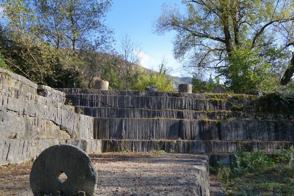 a stone wall with a stone fence