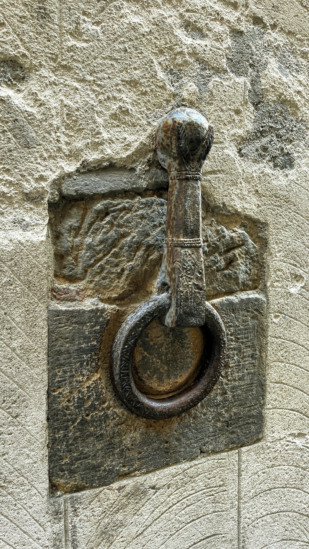 a statue of a person holding a sword