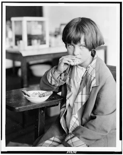 A young girl receiving a nutritious meal as part of the Nourish Her program.