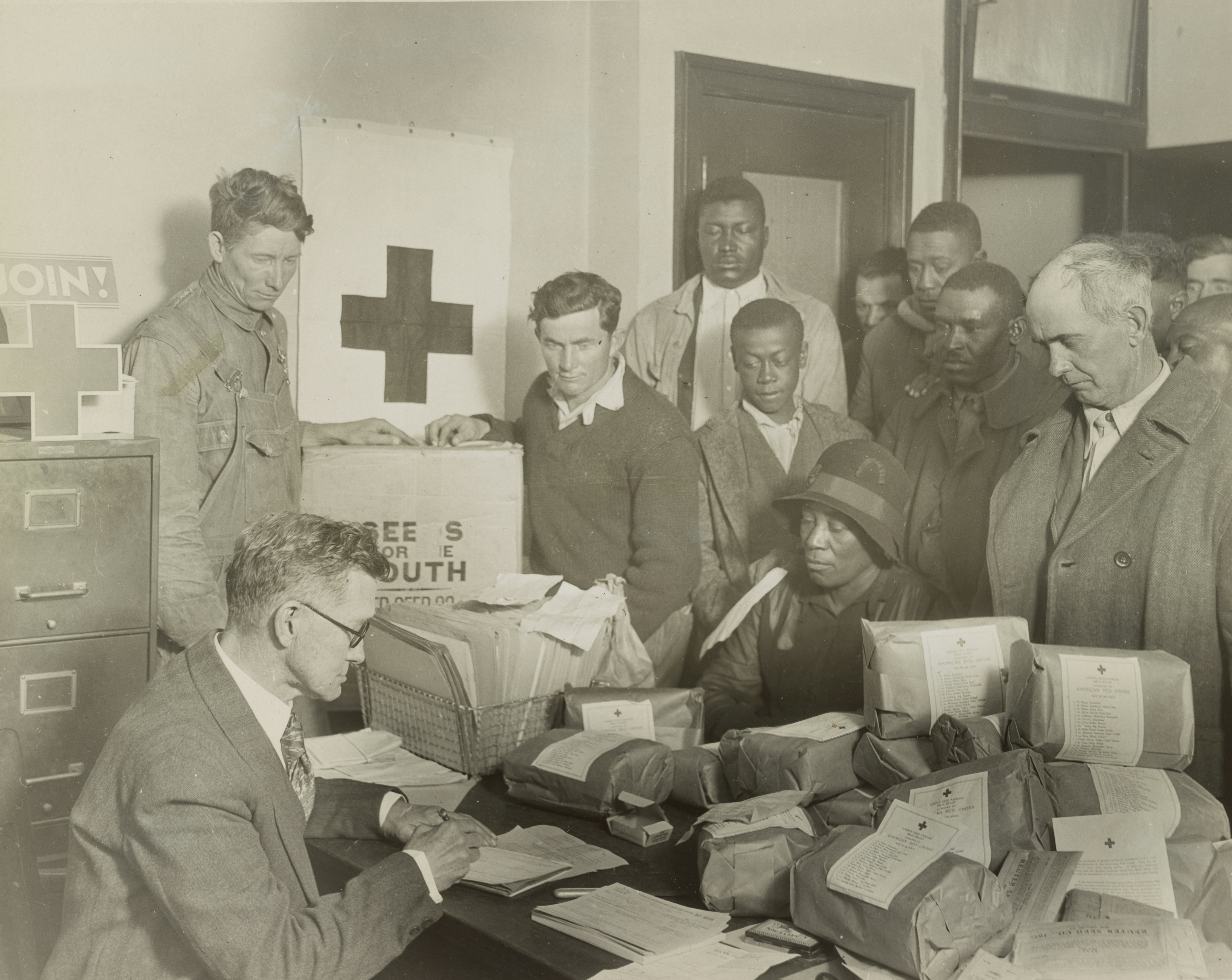 Red Cross food orders and free seed for quarter acre garden plots are given white and colored farmers by the Red Cross chapter at Cleveland, Mississippi. Created 1930 or 1931 by Hine, Lewis Wickes. https://www.loc.gov/resource/ds.01296/