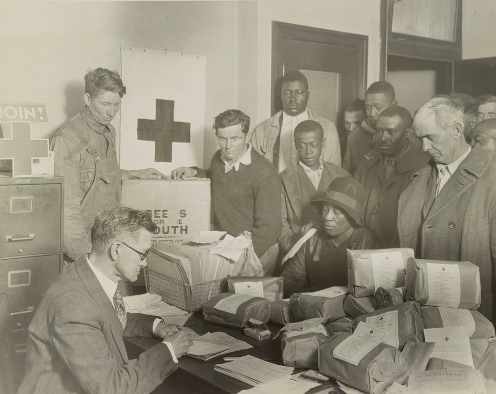 Red Cross food orders and free seed for quarter acre garden plots are given white and colored farmers by the Red Cross chapter at Cleveland, Mississippi. 