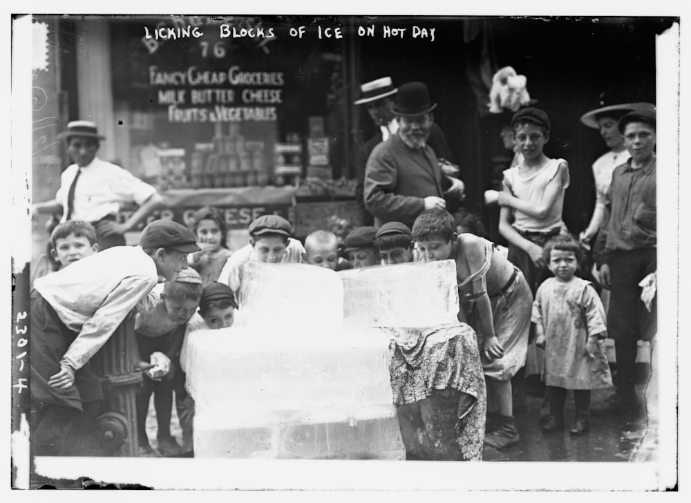 Licking blocks of ice on hot day.