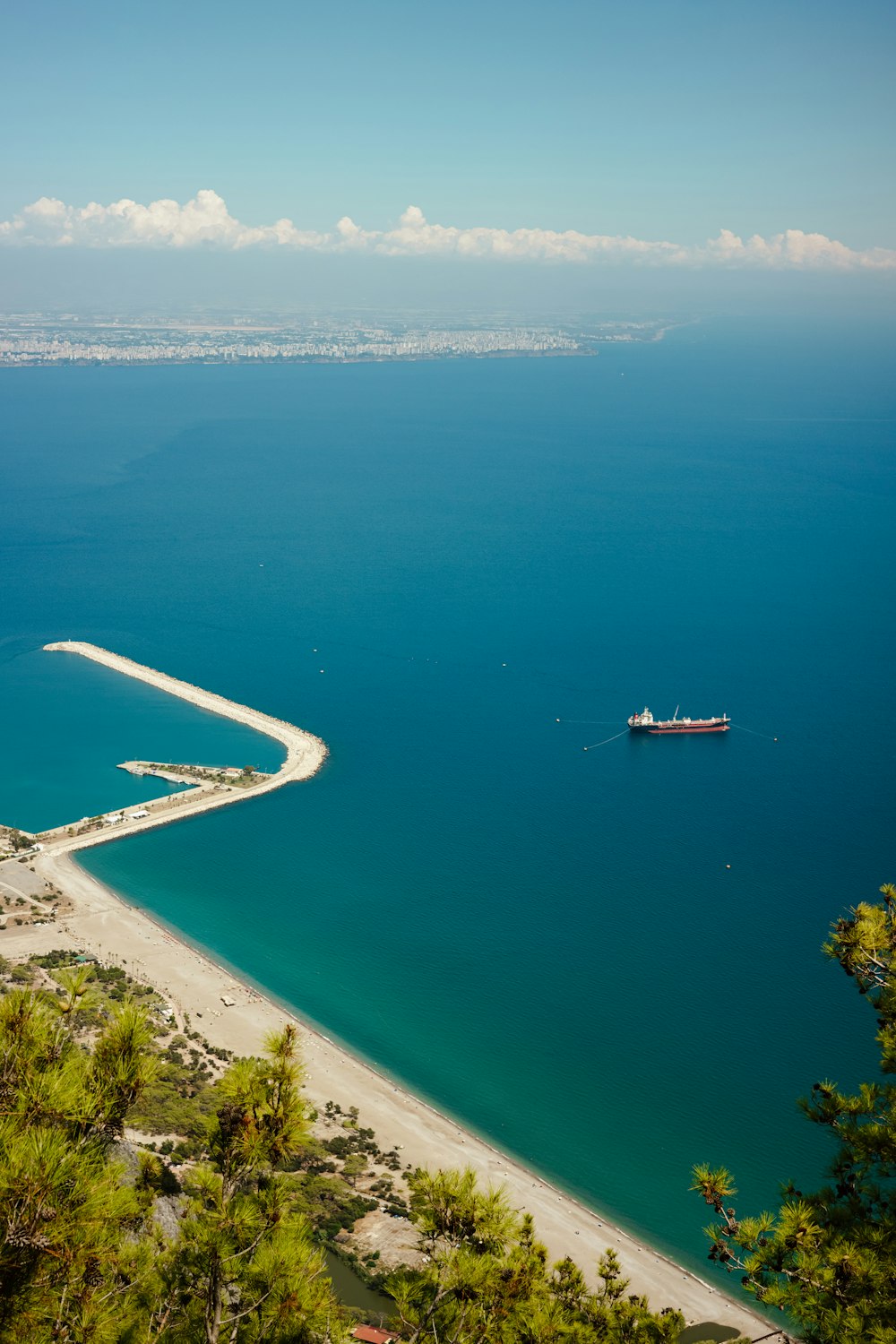 a beach with a boat in the water