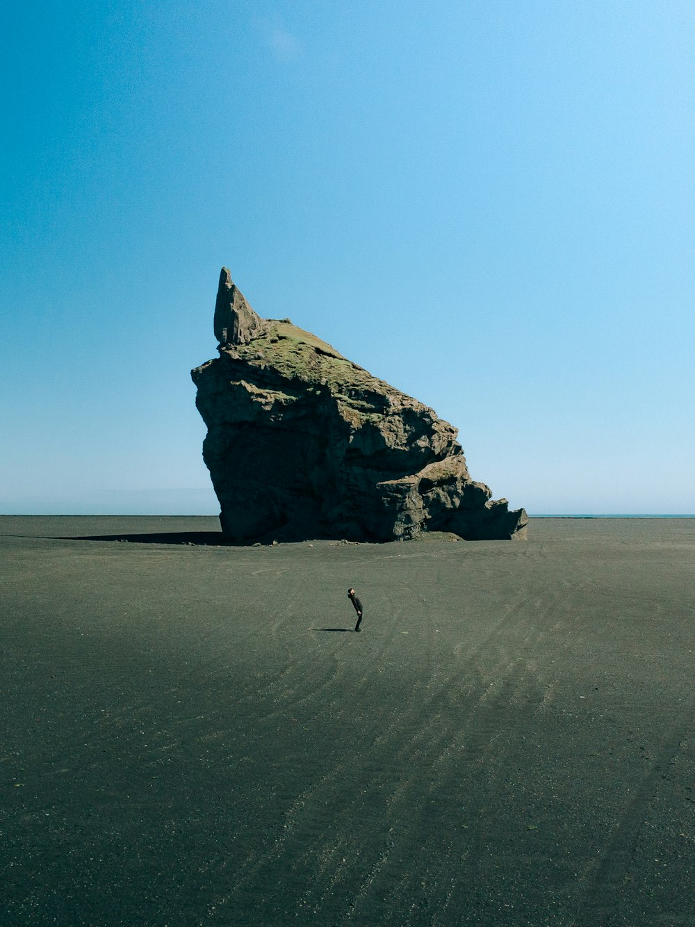 a person walking on a beach