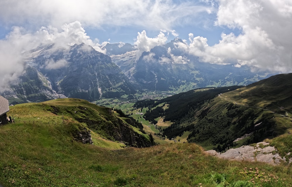 a valley with mountains in the background