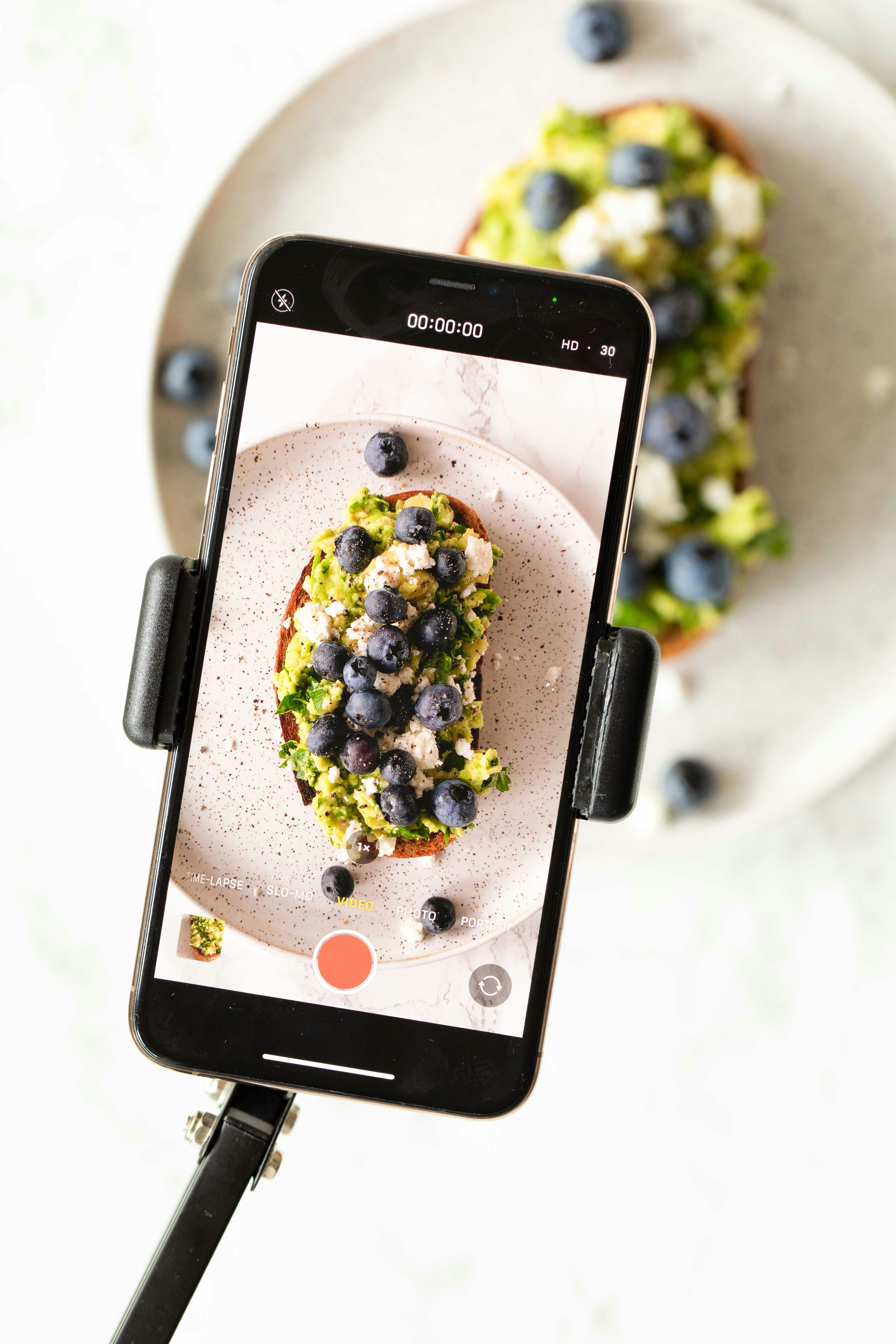 A smartphone displaying a digital restaurant menu with vivid images