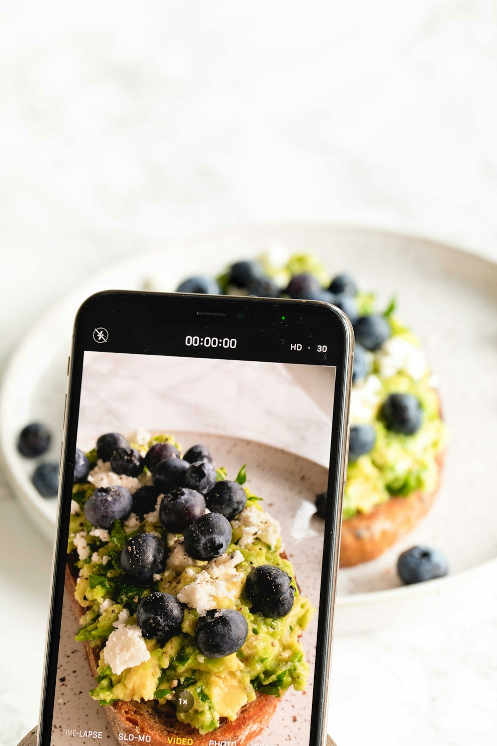 a cell phone with a picture of a dessert on it