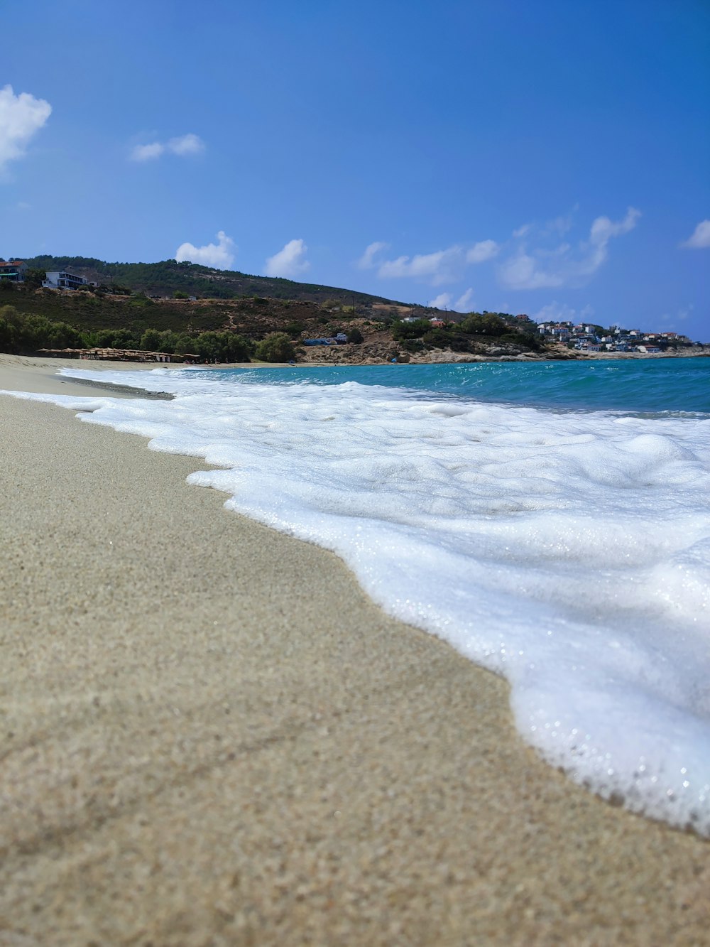 a beach with a body of water