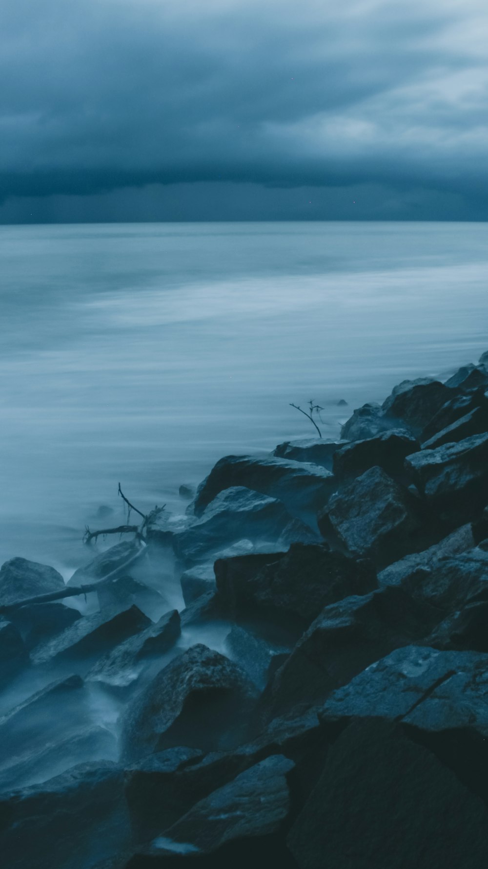 a rocky beach with a boat