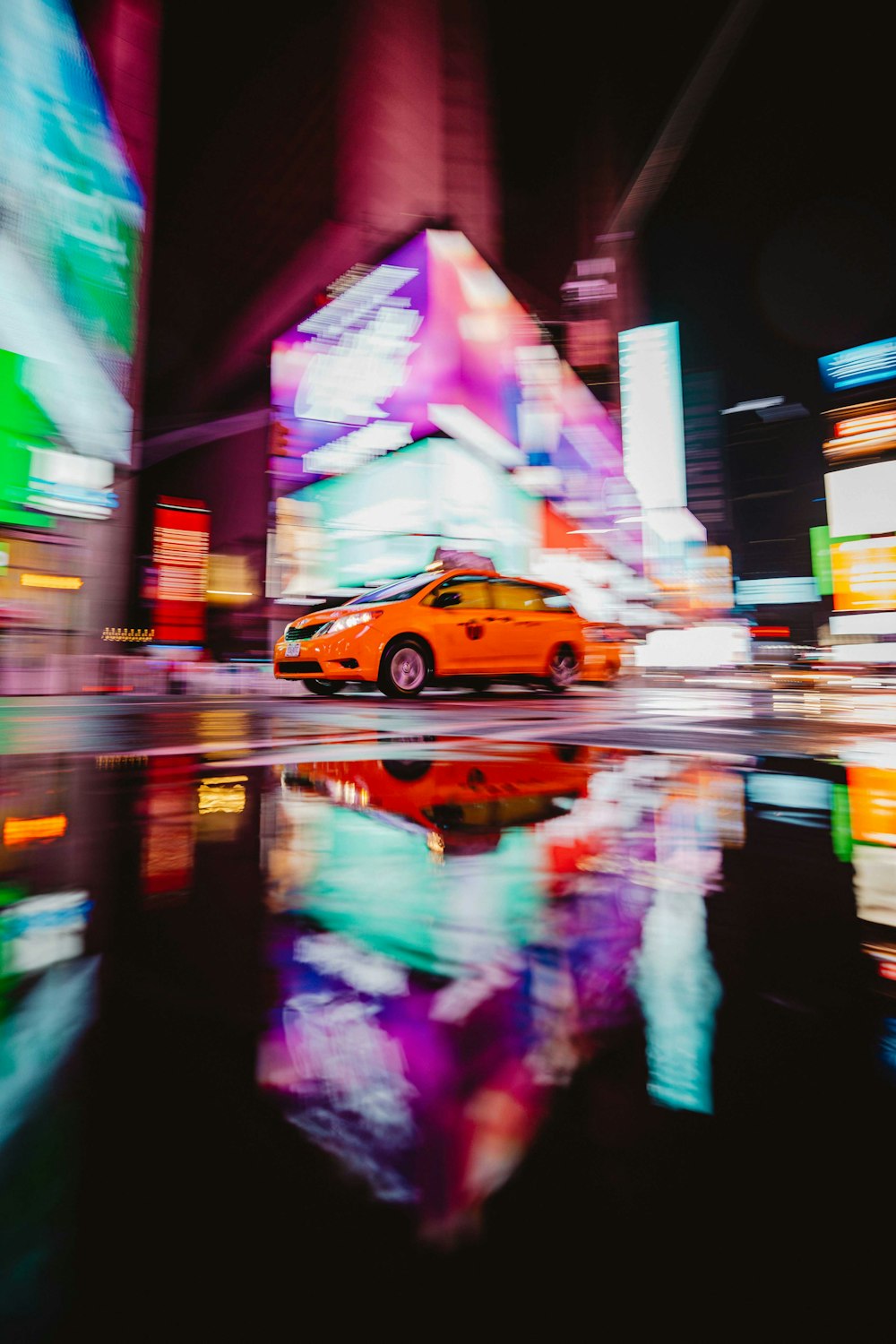 a yellow car on a street