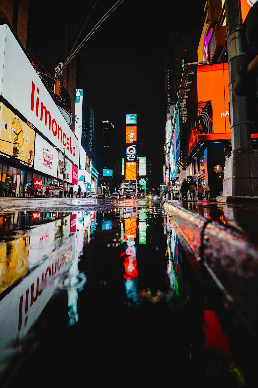 a person walking in a wet street