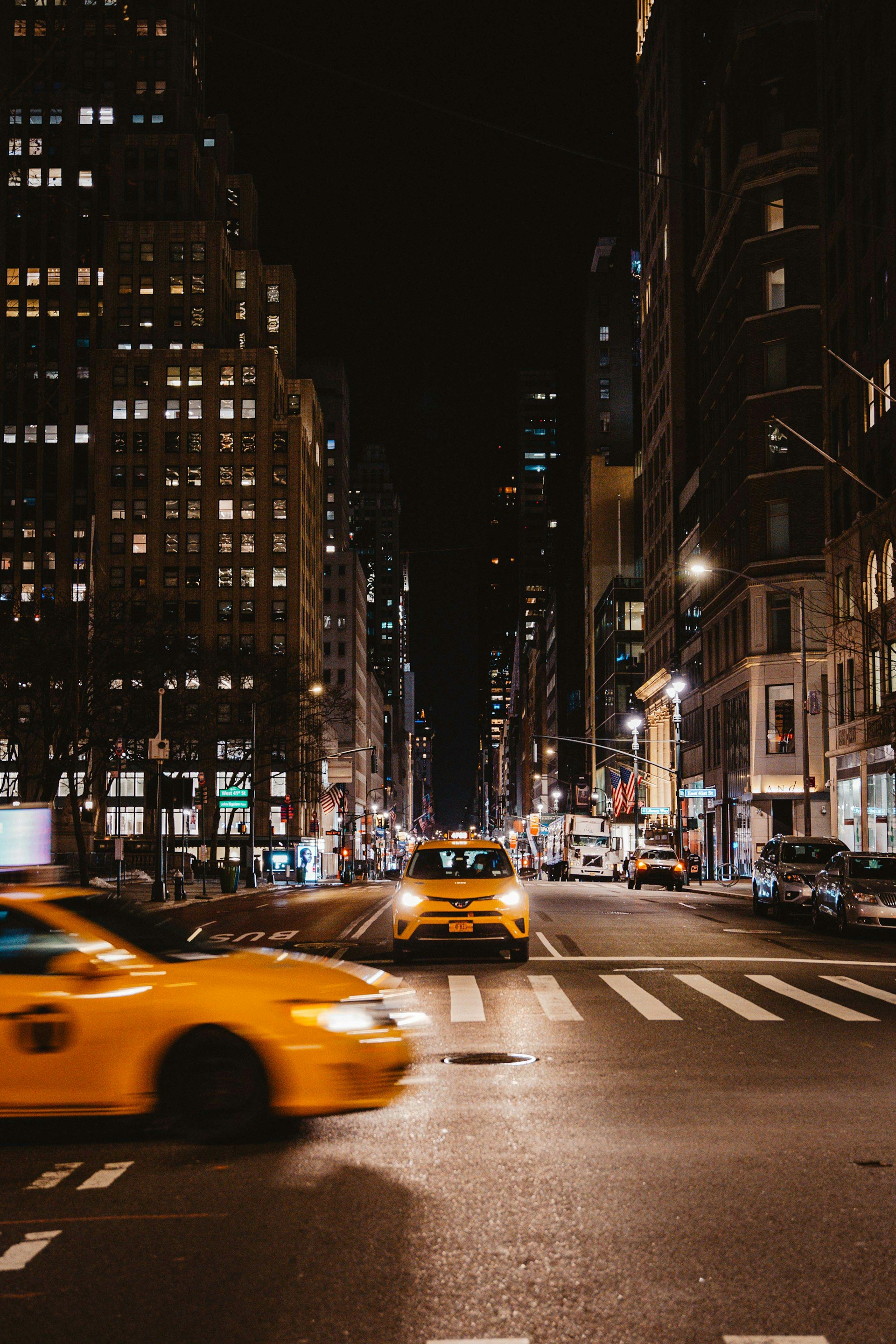 a yellow taxi on a city street