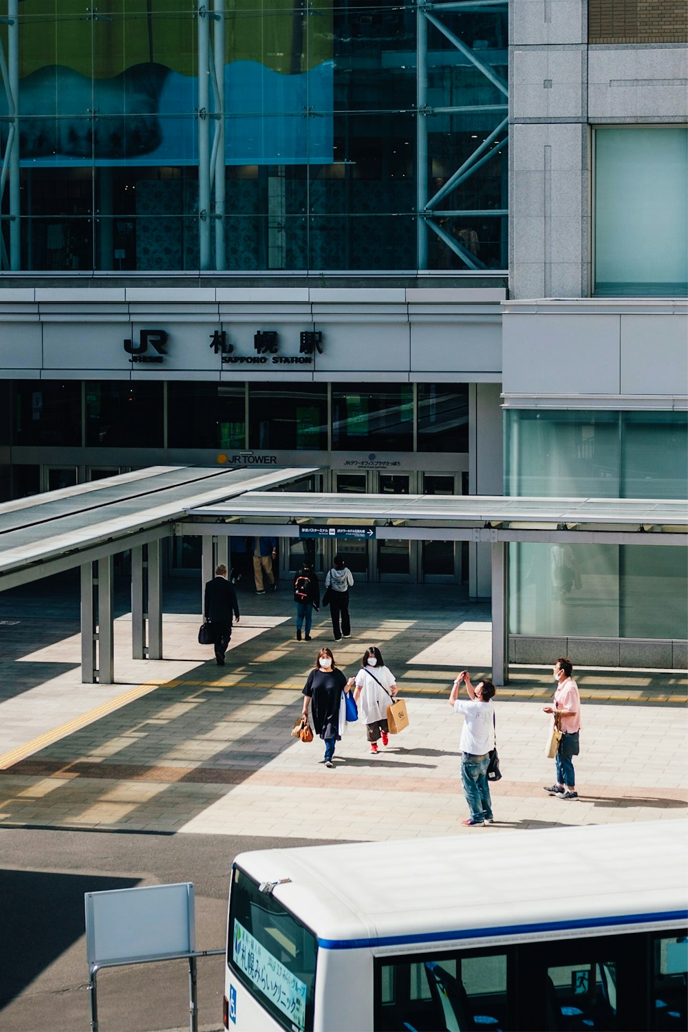 people walking in front of a building