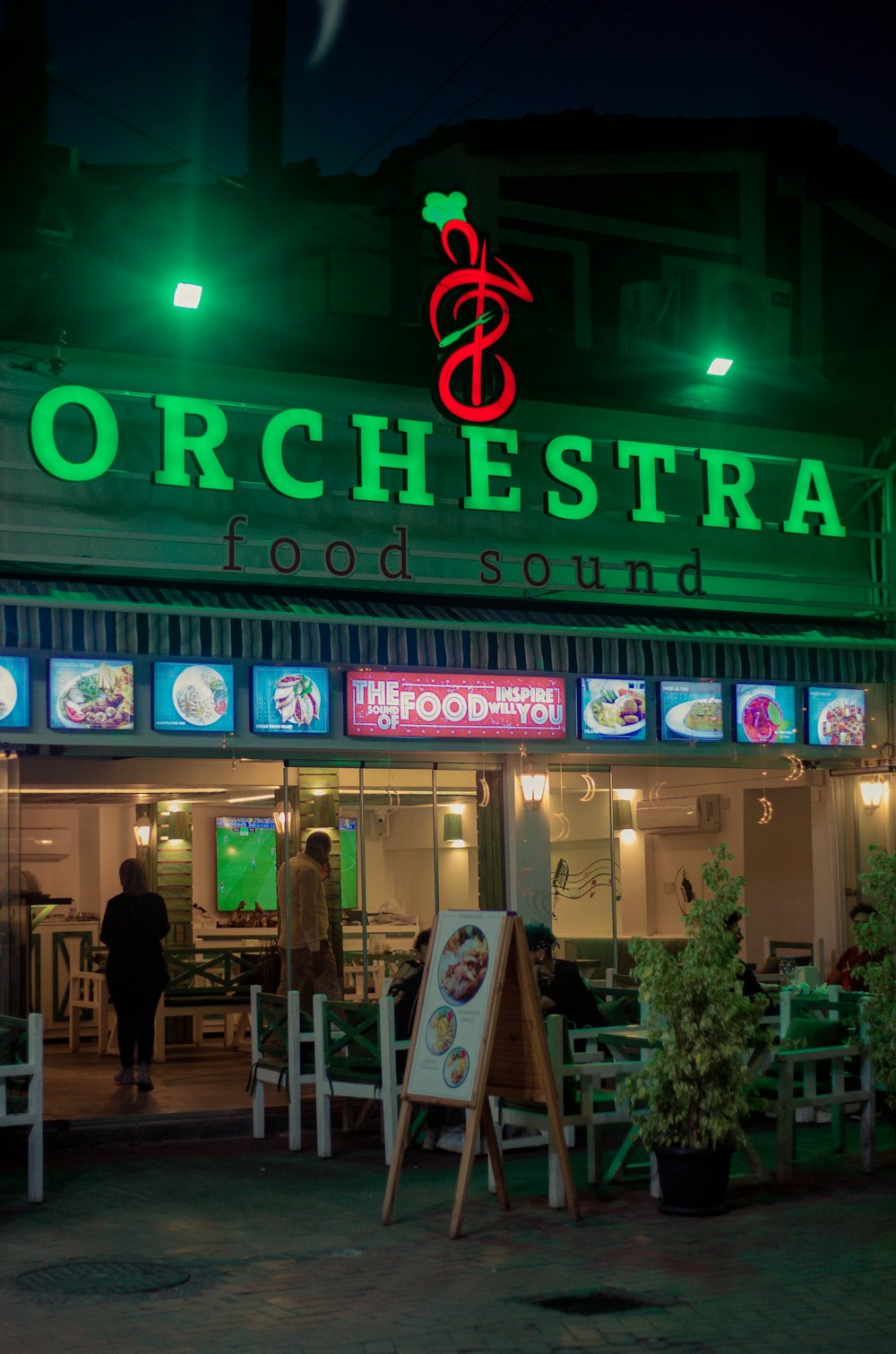 a store front with neon signs