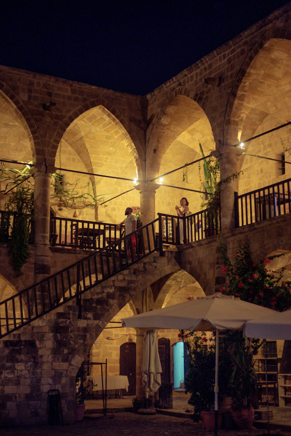 a couple of people standing on a staircase