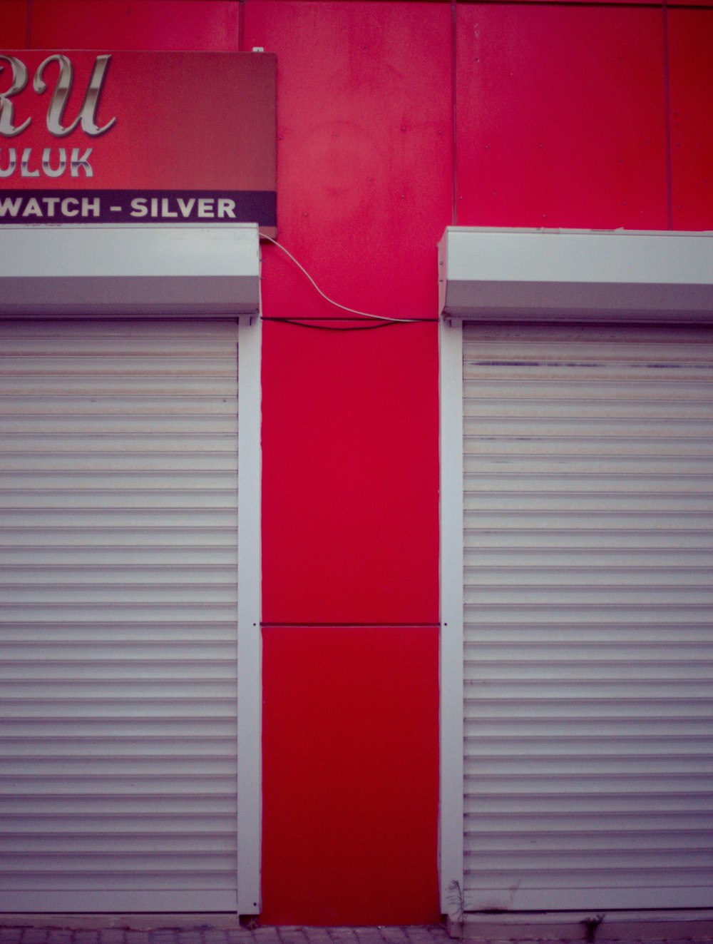 a red building with white doors