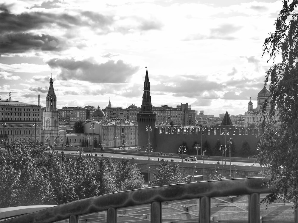 a city with a bridge and trees