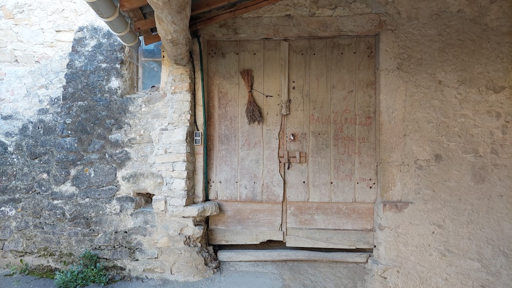 a wooden door in a stone building