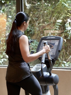 a woman using a weight machine